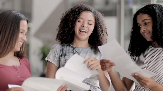 three girls having fun while studying